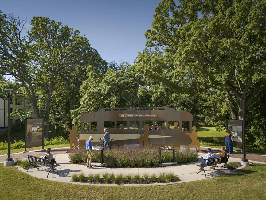 People walking around Waveland Trolley Loop monument